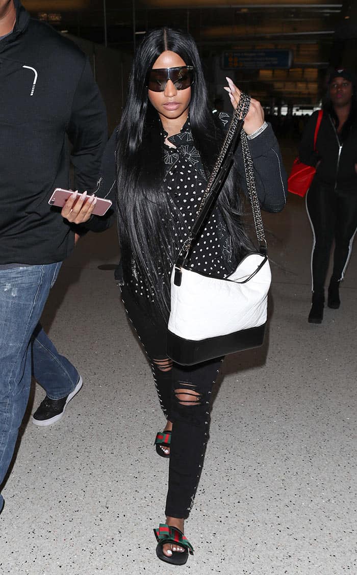 Nicki Minage wearing all-black at the airport