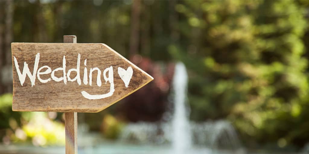 Wooden sign for outdoor wedding