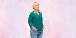 Managing wardrobe through weight changes -- pretty woman wearing jeans and green top
