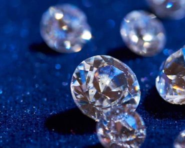 White diamonds on a sparkly blue background
