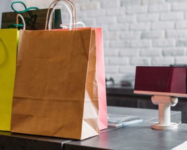Retail store with shopping bags on the counter