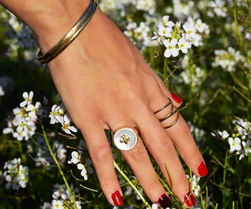 Close-up of woman's hand with ring stack