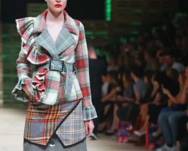 Runway model wearing patterned outfit