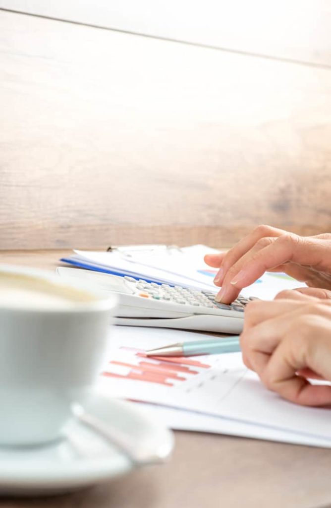 Ways to save — close up of woman budgeting