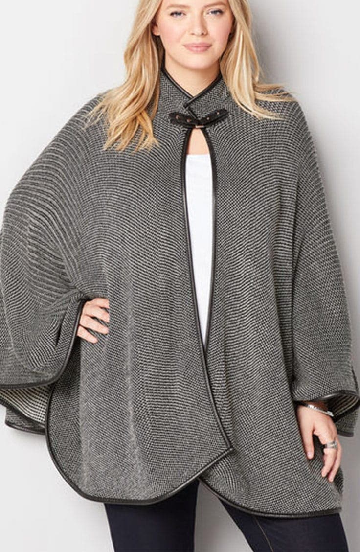 Woman wearing gray cape