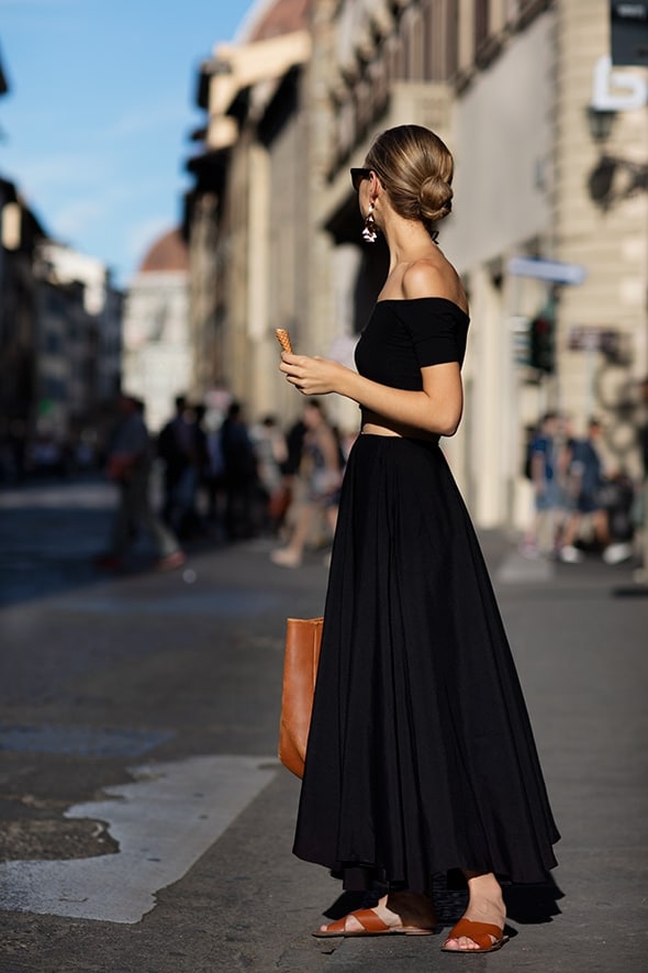 Woman wearing black crop top and maxi skirt