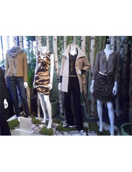 Four outfits on mannequins