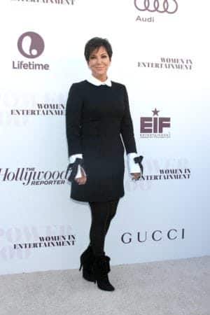 Kriss Jenner wearing black dress with white collar and white cuffs