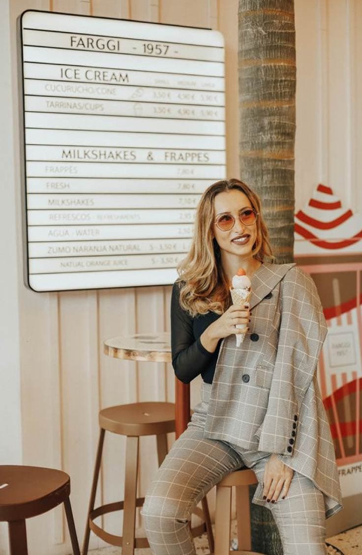 Zlatina Jekova style blogger wearing a tweed suit and holding an ice cream cone.