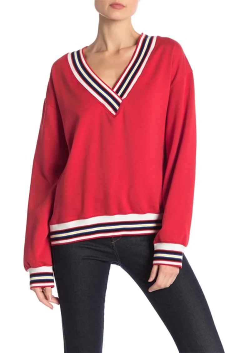 Red sweater with striped details.