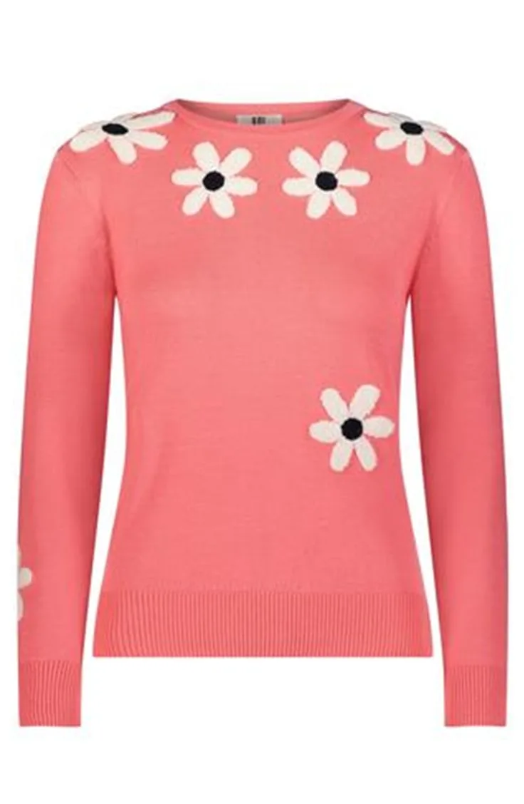 coral sweater with flower detail