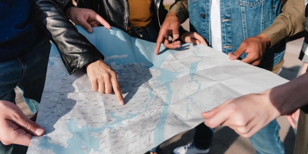 Group of travelers looking at a map