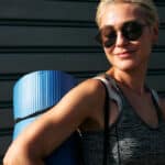 Woman wearing trendy sunglasses outside.