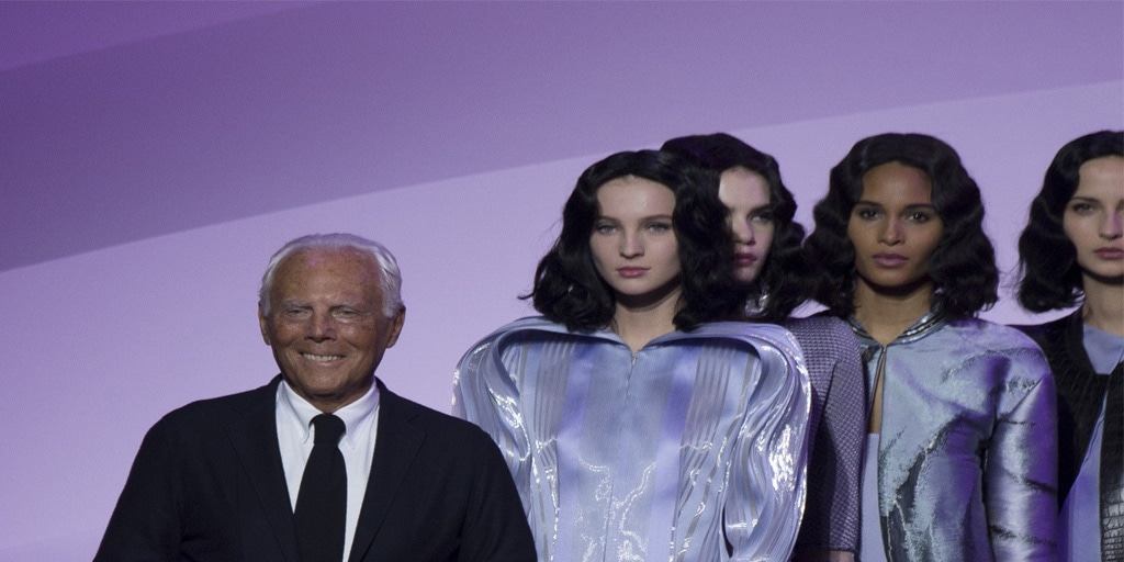 Fashion designer and models on the runway