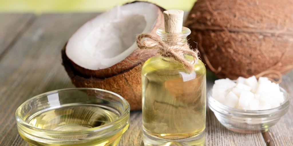 Coconut oil in glass containers on a table