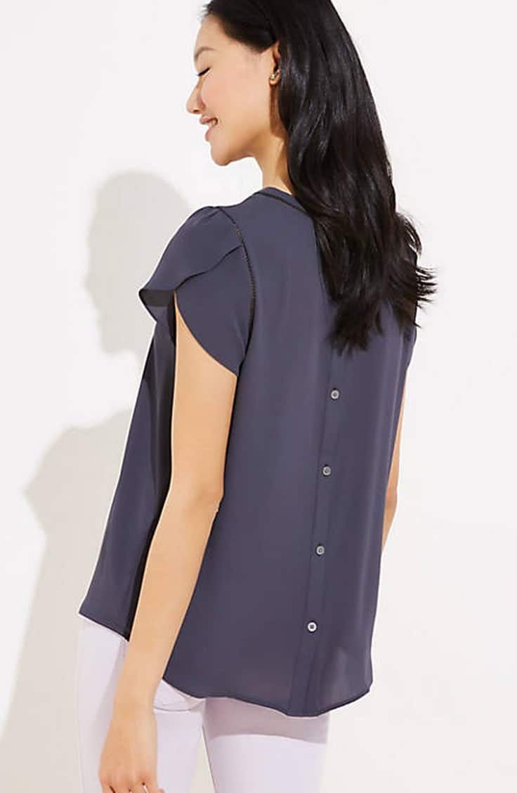 Navy blue button-back top with jeans