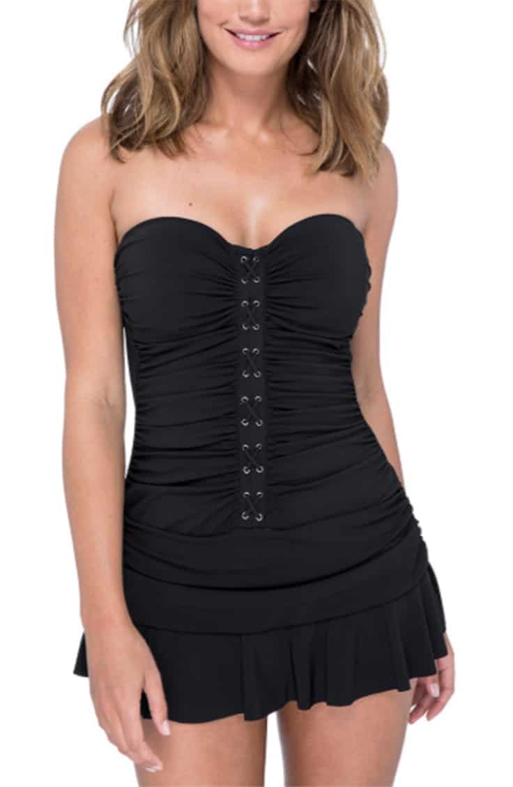 Tall woman wearing black one-piece swimsuit