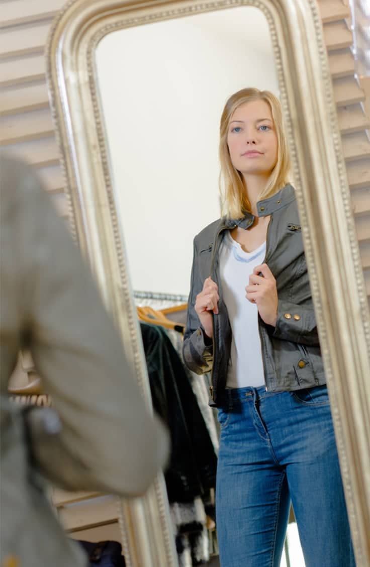 Woman trying on jacket