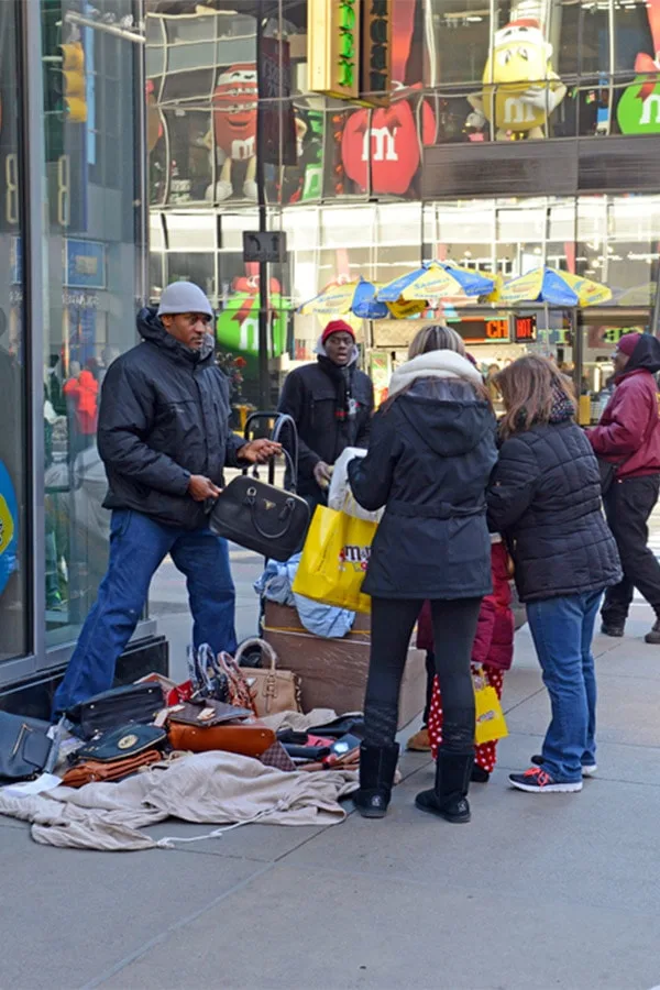 Women buying fake bags in Manhattan