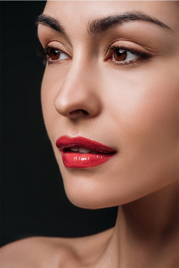 Woman wearing bright red lipstick