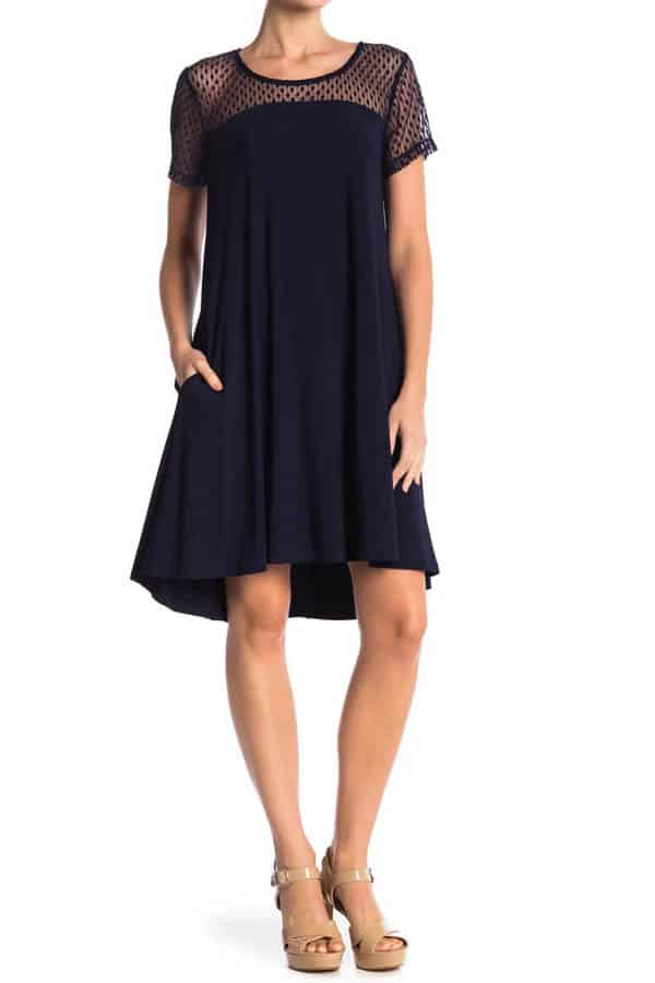 Model wears shift dress, a good style of dress when you're losing weight.