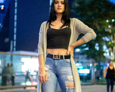 Woman wearing duster cardigan and crop top