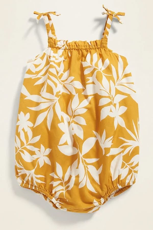 Yellow onesie with patterned print 