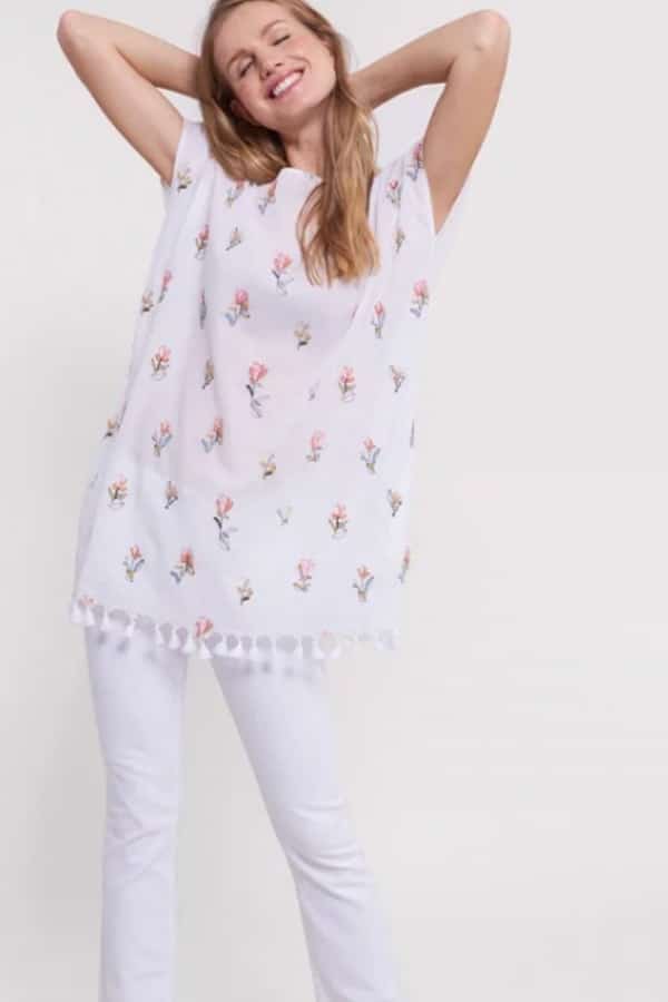 Mommy and Me Fashion: Summer Outfit Picks 5 Woman wearing lightweight white tunic with flower print