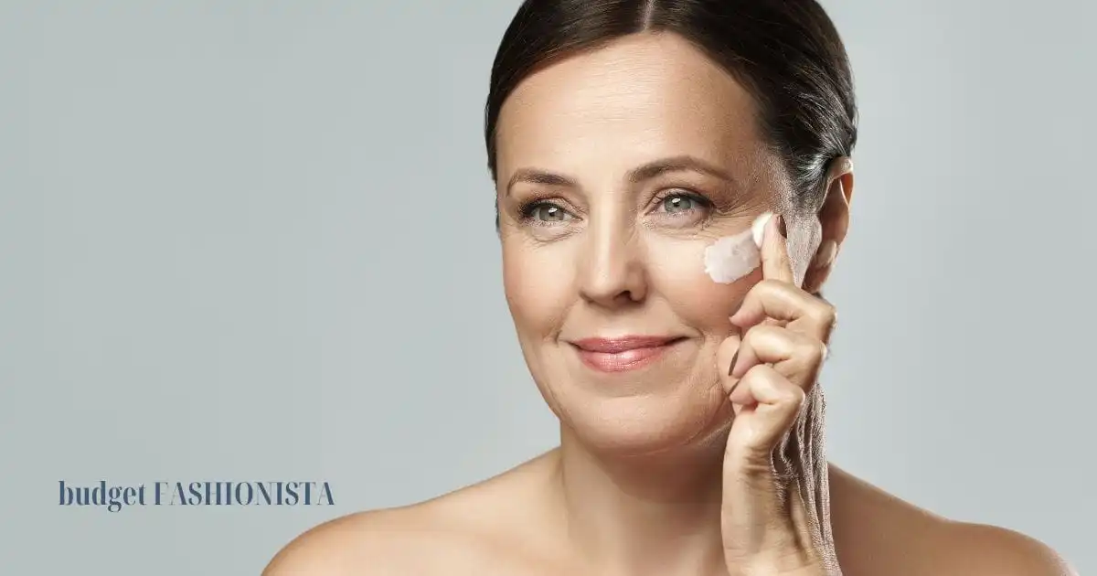 Close-up of woman putting moisturizer on her face.