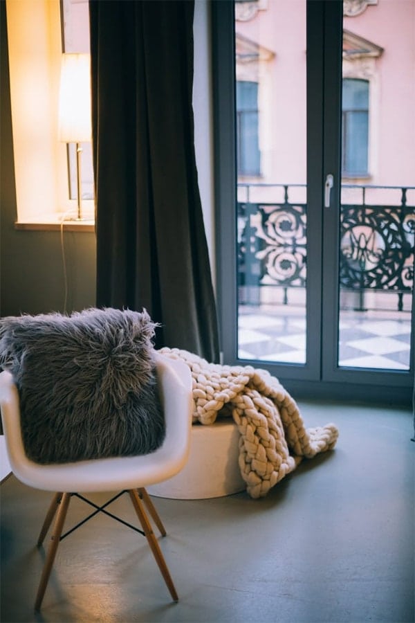 Well decorated room with pillows and textiles