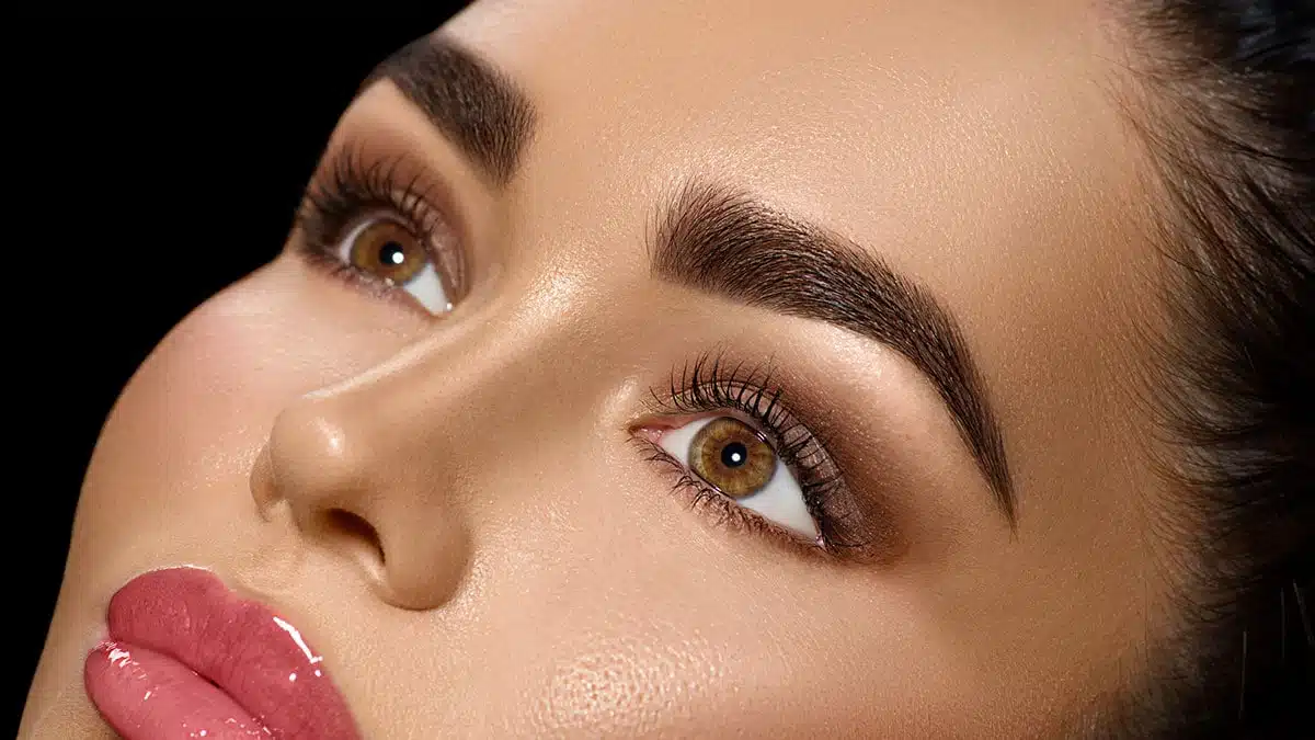Closeup of woman with brown eyes and professional makeup