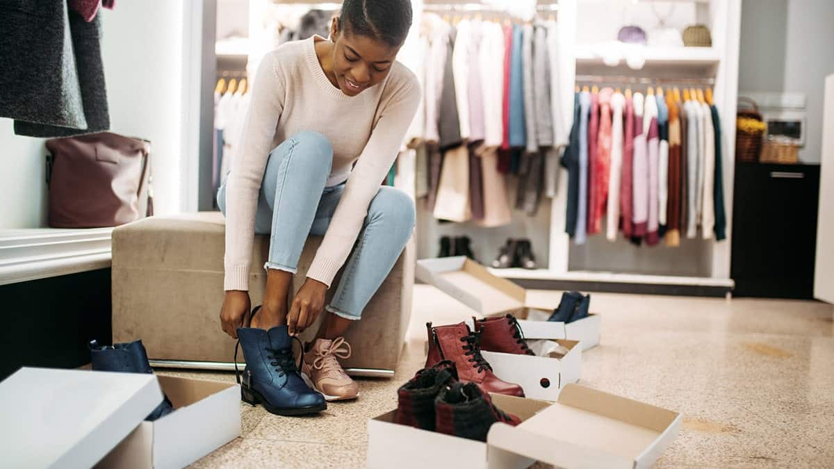 Woman trying on trending fall shoes