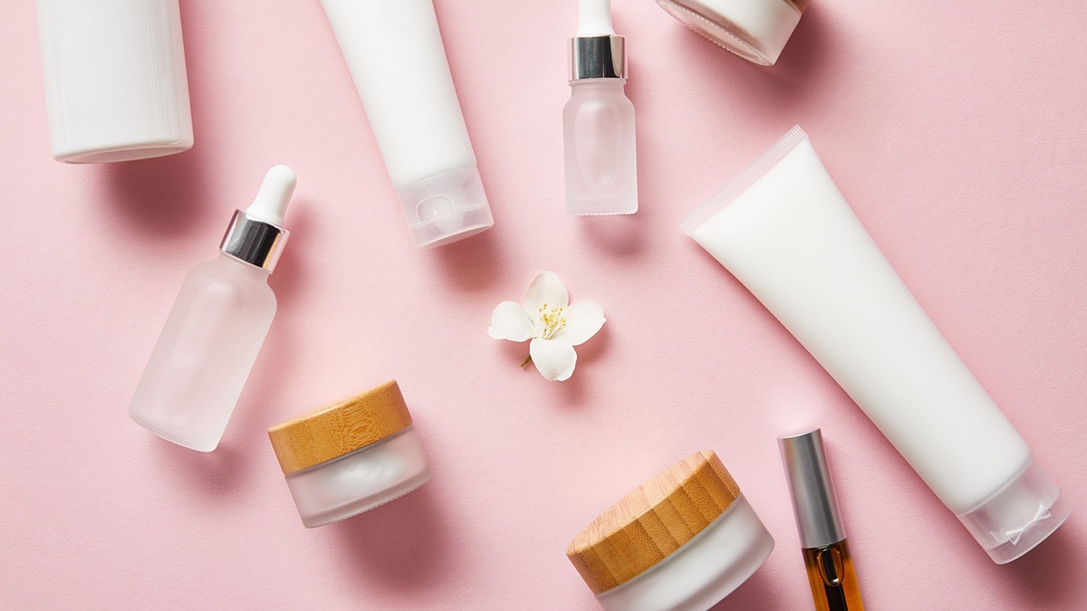 Beauty products on pink table