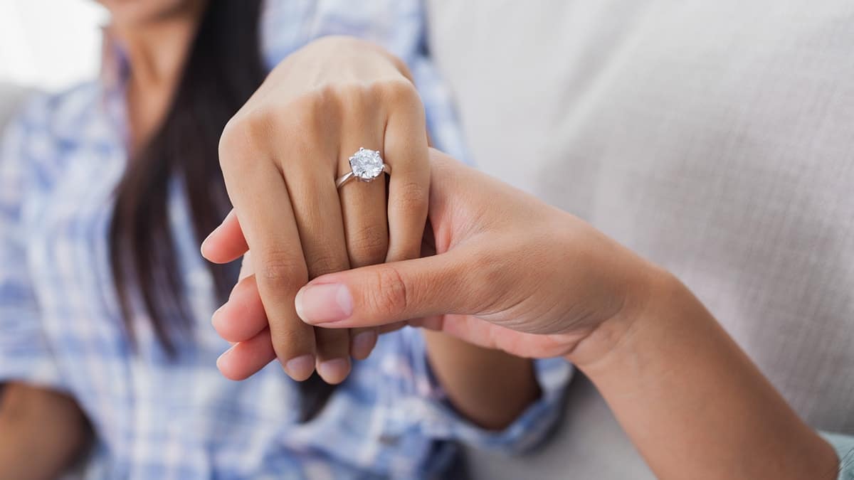 close up of woman's engagement ring