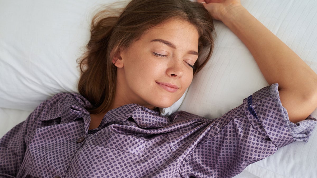 Woman sleeping in pajamas