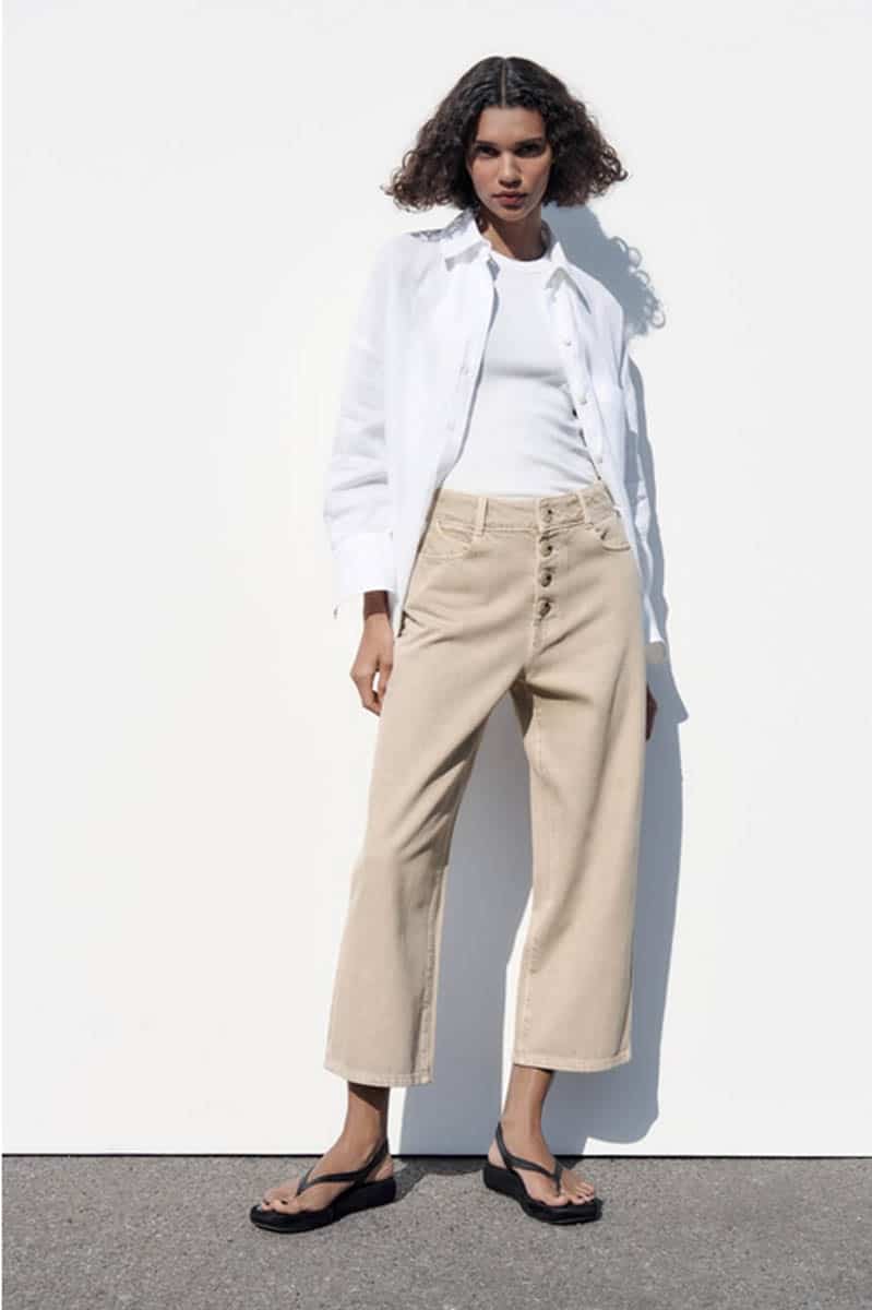 Model wears wide-legged crop pants.