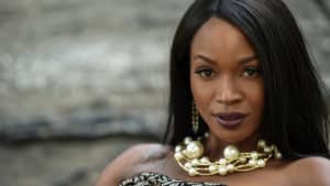 Woman wearing chunky pearl necklace