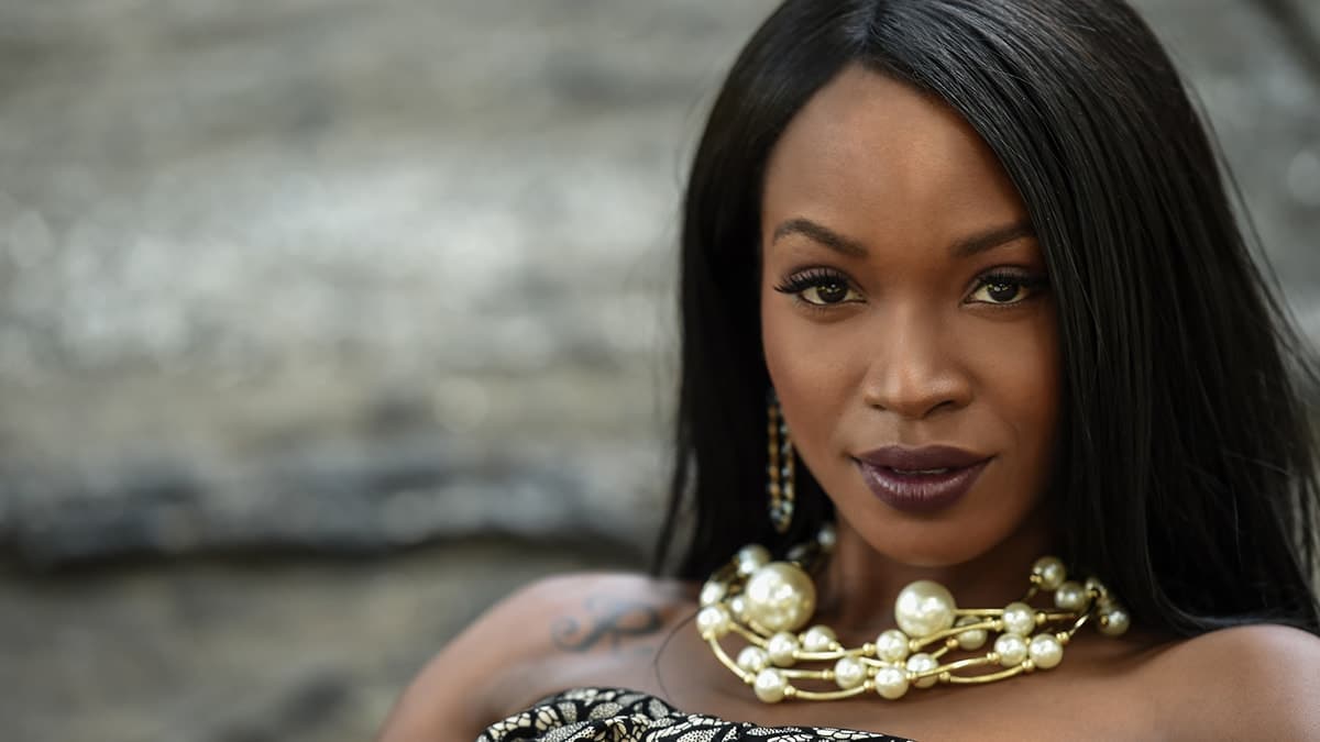 Woman wearing chunky pearl necklace