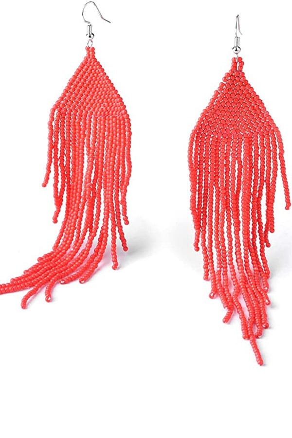 Orange beaded tassel earrings.