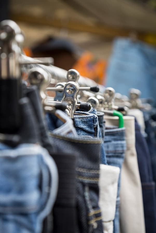 Rack of jeans in thrift store