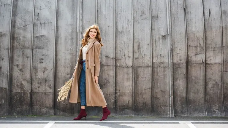 Woman wearing camel trenchcoat