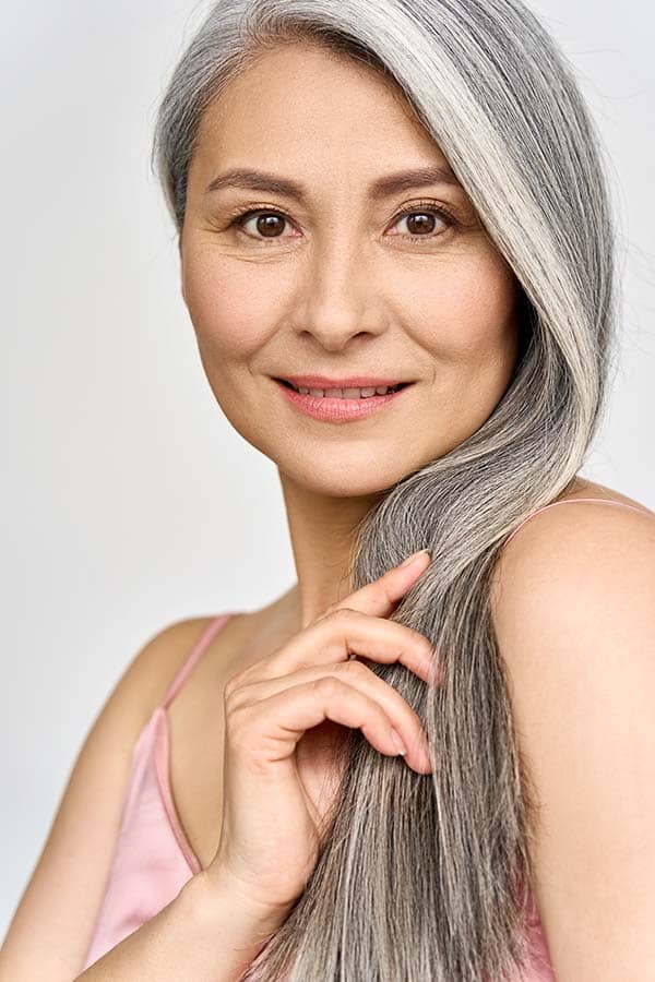 Woman with her natural gray hair color.