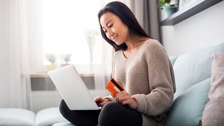 Woman shopping Amazon Prime Day at home.