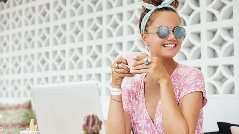 Fashion Basics: Classic Accessories We All Need 1 Woman wearing key fashion basics -- sunglasses, jewelry, and scarf.
