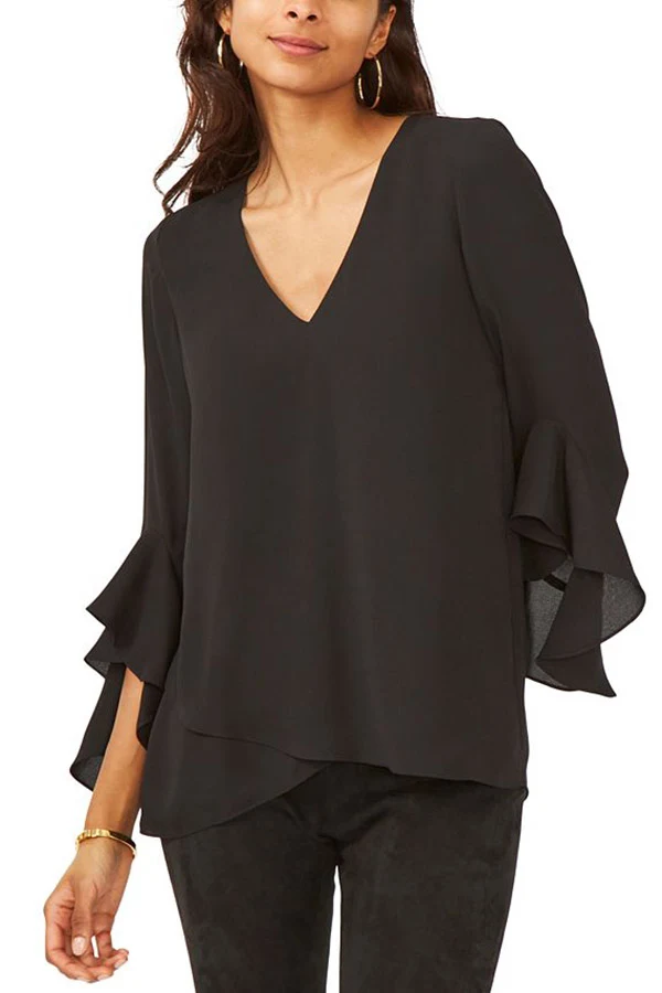 Tiered black top as an example of punk fashion for women over 40.