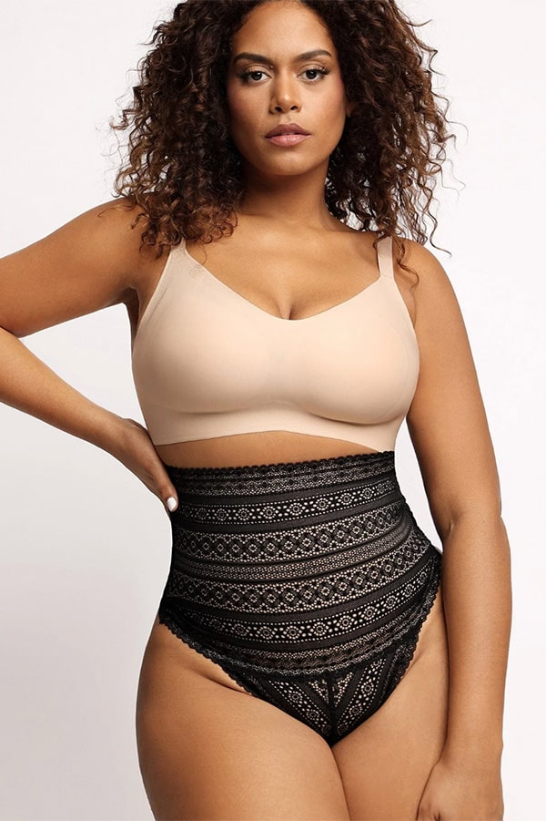 Model wears high-waisted lace panty and beige bra.