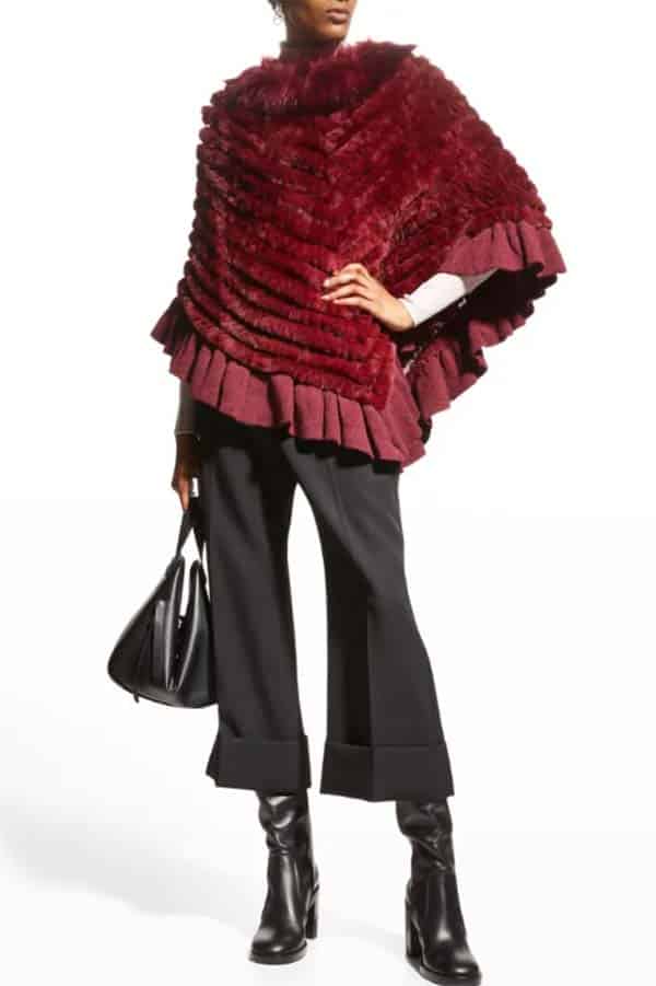 Fur trimmed poncho in burgundy.