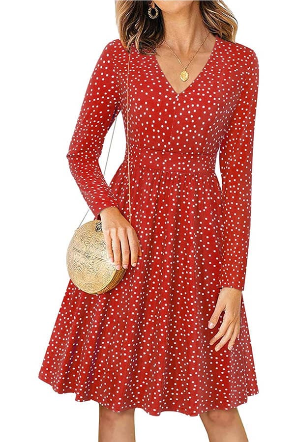 Close-up of model wearing polka-dot midi dress.