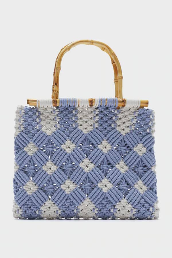 Blue and creme woven bag with bamboo handle.