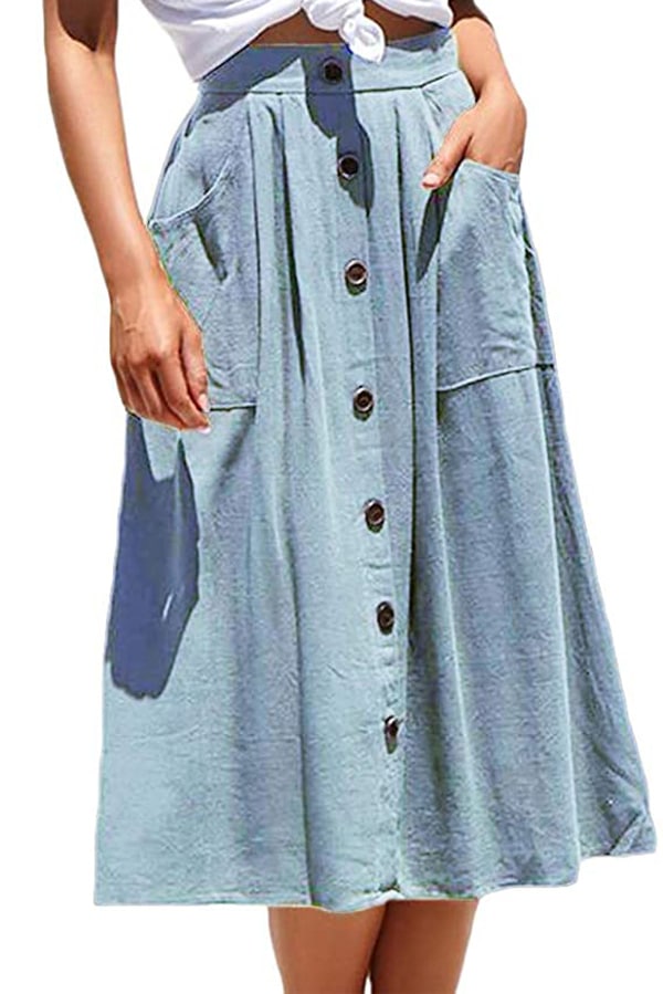 Close up of model wearing chambray skirt with midi length.